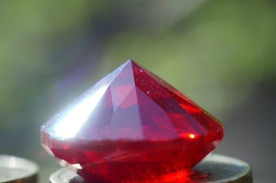 Red ruby close-up. Decorative glass.