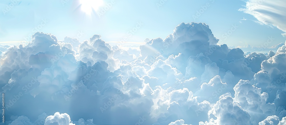 Aufkleber Sunlight filtering through clouds in a blue sky creates a serene atmosphere in the copy space image.