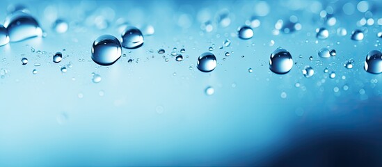 Blue water droplets to blend with a copy space image.