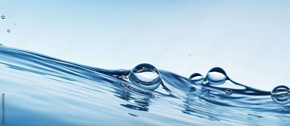 Poster fresh and clean water surface with droplets, providing a serene background for copy space images.