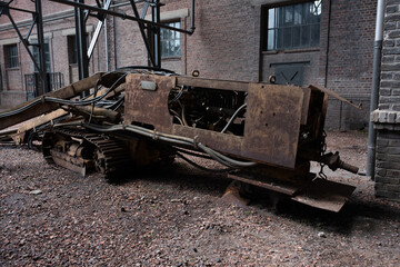 Industrial machines from an old abandoned coal mine, old and rusty.