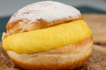 Brazilian cream donuts traditional Brazilian sweet on a wooden board_15.