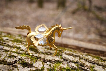 A unicorn figurine decorated with decorative glass.