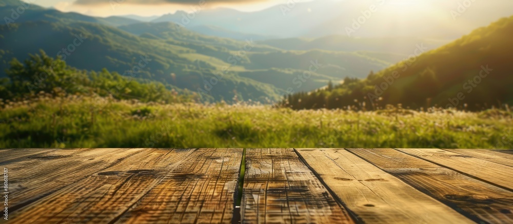 Aufkleber a wooden table top set against a blurry mountain and grass field backdrop, evoking a sense of freshn