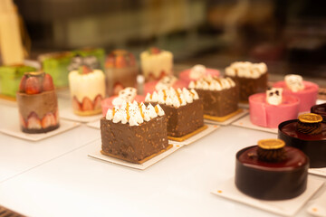 Types of cakes. Delicious cakes in bulk at the patisserie counter