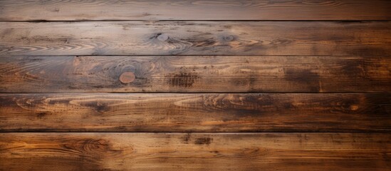 Naklejka premium Vintage wooden table with an uneven surface providing copy space image.