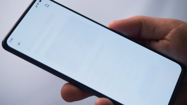 Learning to code online. Checking full stack web development online course using app for mobile phone. Fictional Interface.