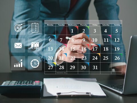 Businessman with meeting schedule, calendar, marking due date, appointment calendar, reminder for organizer, meeting agenda. Schedule an activity time management concept