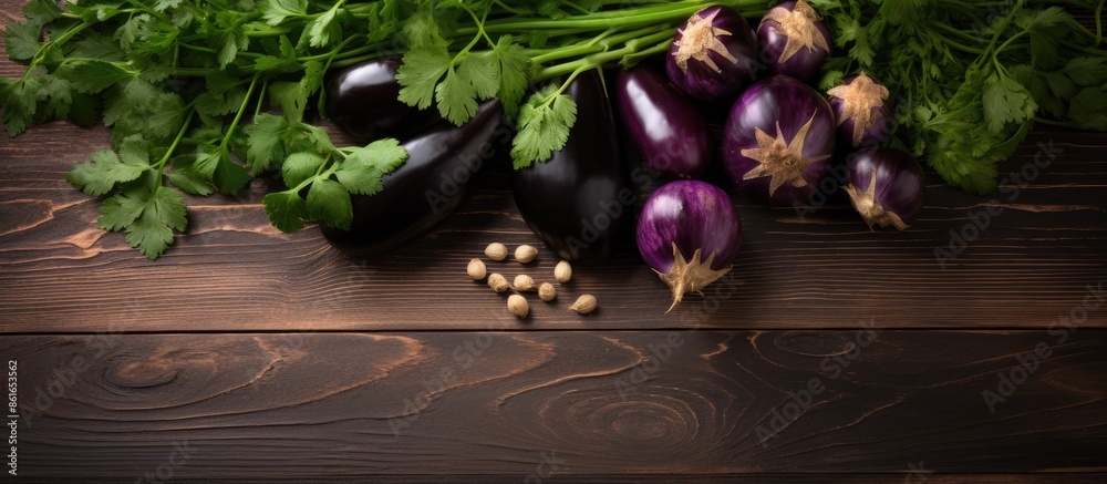 Poster coriander and eggplant arranged on a wooden table with a vast copy space image.