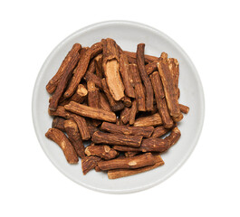 flat lay top view pile of dry dandelion root isolated on white background cutout in bowl