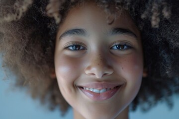 A close-up view of a young girl with curly hair