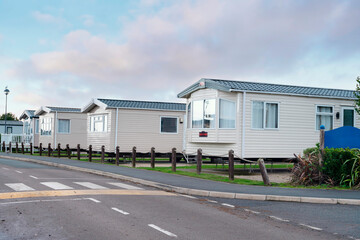 Row of Mobile Homes in Park on Cloudy Day