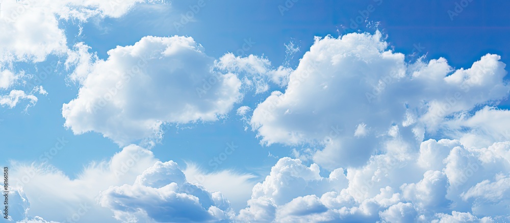 Poster Close-up of a textured blue sky with soft clouds, ideal as a background image with copy space.