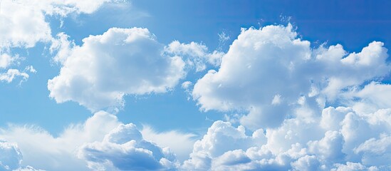 Close-up of a textured blue sky with soft clouds, ideal as a background image with copy space.