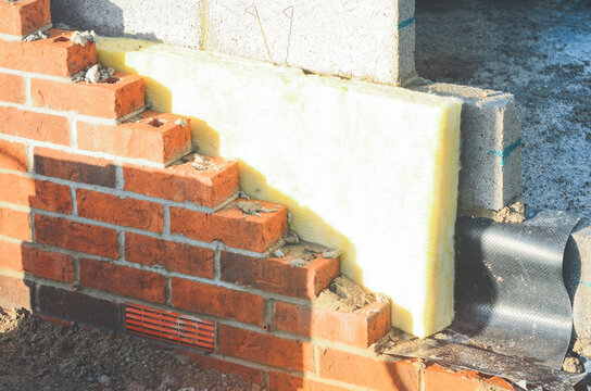 Brick Wall Insulation Installation With Foam Boards and Dpm Membrane