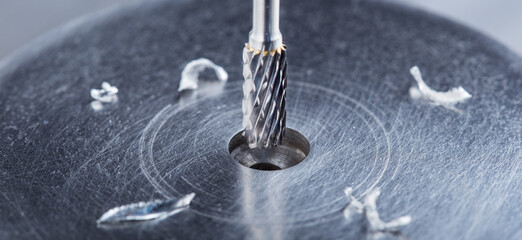 Milling cutter make sink in hole in steel billet. Locksmith work.