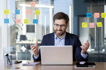 Businessman in suit having video call in modern office setting, Discussing work, collaboration, technology, communication, and strategy. Professional environment and corporate meeting setup