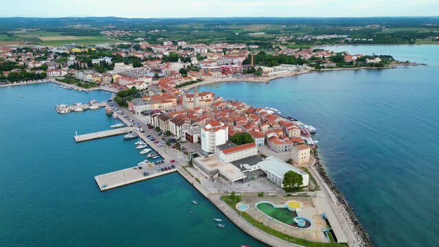 A stunning aerial view of Umag, a charming coastal town in Istria, Croatia. Known for its beautiful beaches, historic architecture, and vibrant marina, Umag offers a perfect blend of relaxation