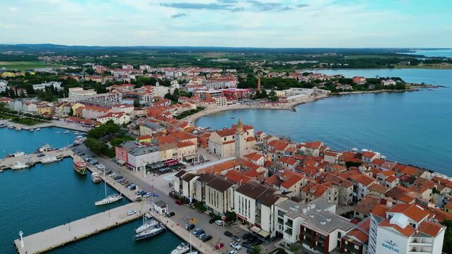 A stunning aerial view of Umag, a charming coastal town in Istria, Croatia. Known for its beautiful beaches, historic architecture, and vibrant marina, Umag offers a perfect blend of relaxation