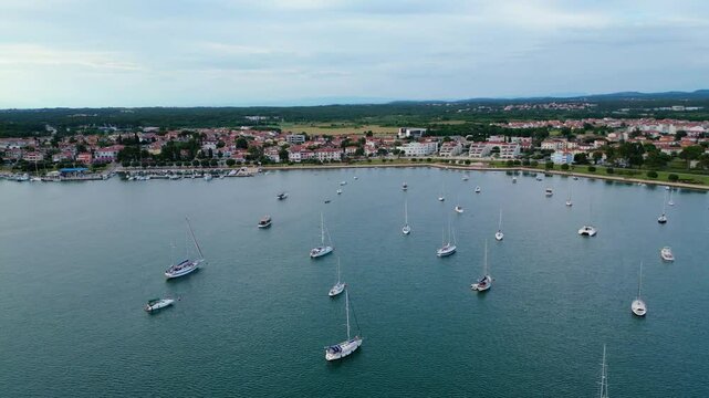 A stunning aerial view of Umag, a charming coastal town in Istria, Croatia. Known for its beautiful beaches, historic architecture, and vibrant marina, Umag offers a perfect blend of relaxation