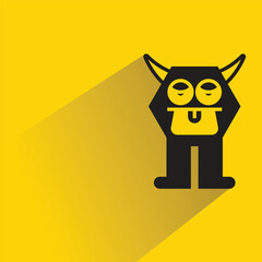 cute monster character with drop shadow on yellow background