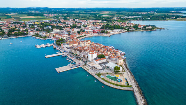 A stunning aerial view of Umag, a charming coastal town in Istria, Croatia. Known for its beautiful beaches, historic architecture, and vibrant marina, Umag offers a perfect blend of relaxation