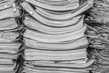 Paper documents stacked in archive. folders with documents on the shelves of archive room. Office...