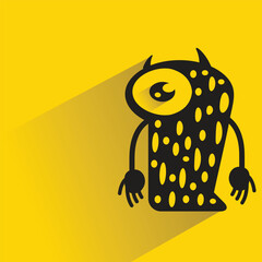 funny monster character with shadow on yellow background