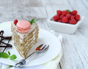 piece of cake dessert with fresh berries and macaroons