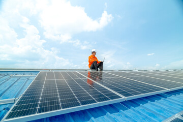 engineer man inspects construction of solar cell panel or photovoltaic cell by electronic device. Industrial Renewable energy of green power. factory worker working on tower roof.