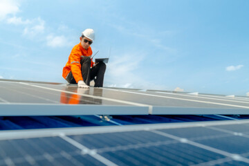 engineer man inspects construction of solar cell panel or photovoltaic cell by electronic device....