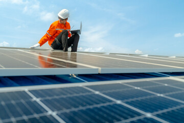 engineer man inspects construction of solar cell panel or photovoltaic cell by electronic device....