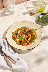 Crispy Eggplant with Tomatoes and Cheese in Sweet and Sour Sauce - Authentic Still Life in Natural Sunlight