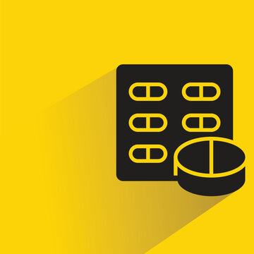 medicine tablet and pill icon with shadow on yellow background