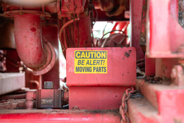 Caution safety sign of moving part inside the machine, dangerous for hand and finger injury....