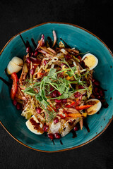 Vibrant Salad with Tongue, Pomegranate, and Fresh Vegetables on Dark Background