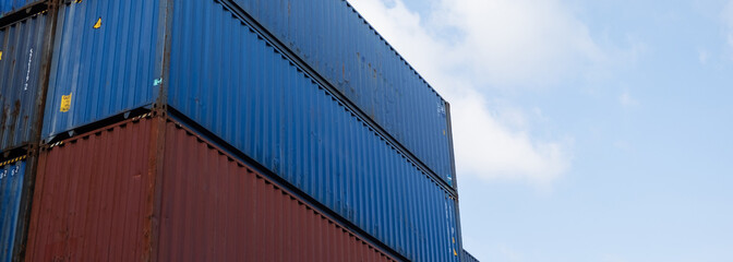 Fototapeta premium Background of container box stack for freight cargo shipping. Logistics import export business at factory warehouse.