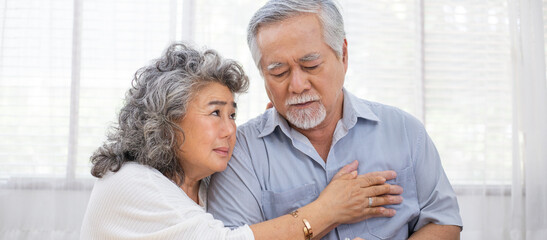 Asian senior woman take care of her sickness husband. Grandmother giving empathy and support to...