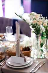 Serving the festive table. Dishes and crockery.