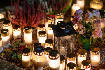 Grave lights on a memorial graveyard at night.