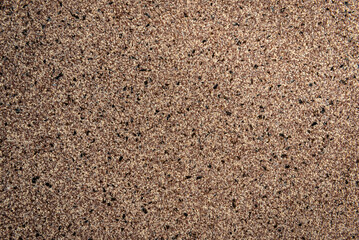 Brown decorative mosaic plaster on the corridor wall.