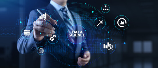 Data science analytics concept. Businessman pressing button on screen.