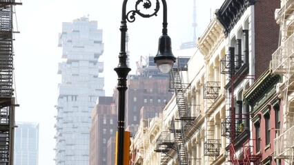 New York City Manhattan Soho fashion district near Broadway street. USA urban building facade, old american architecture. Shopping in NYC, United States. Business and residential real estate. Lantern