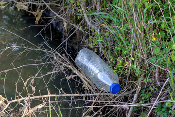 Plastic bottle in nature as garbage