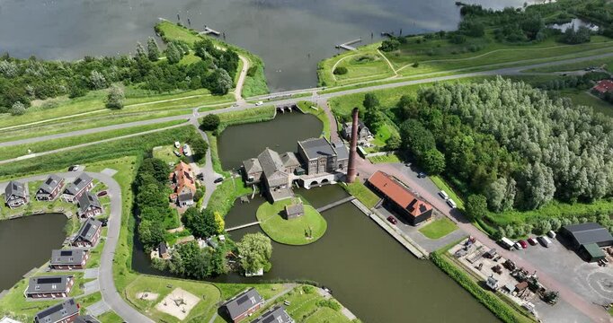 the steam pumping station "Vier Noorder Koggen" surrounded by greenery in Medemblik, Netherlands