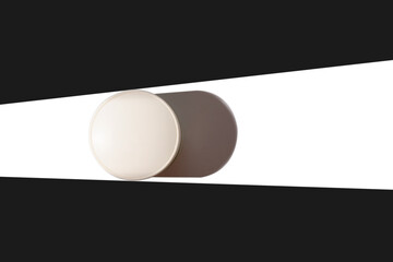 White glass container for cosmetic cream on a white background.