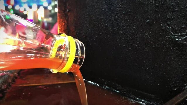 Add oil to the lamp, Hand is pouring oil into lamp to make a wish,Add oil to lamp,Buddhist merit making,Make merit for temple Thailand Buddha monk