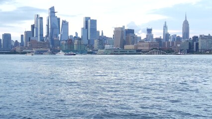 Naklejka premium New York City waterfront skyline, Manhattan Midtown Hudson Yards buildings, riverfront skyscrapers. Waterside cityscape from Pier A Park, Hoboken, New Jersey. United States architecture. Hudson river.