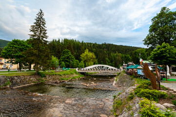 Famous white bridge over Elbe river at Spindleruv Mlyn city, Czech Republic. Famous tourist destination.
