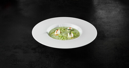 Fresh Cucumber Gazpacho with Mozzarella Cheese Garnish on Black Background - Cold Summer Soup